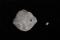 Vue d’artiste du système binaire d’astéroïdes Didymos et sa lune Dimorphos.