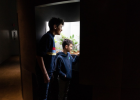 Two boys are observing the insects in one of the vivariums of the Tête-à-Tête room.
