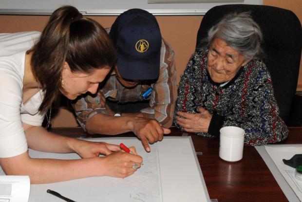 Interview about harvest sites with the help of a map of Nain, Nunatsiavut, Labrador